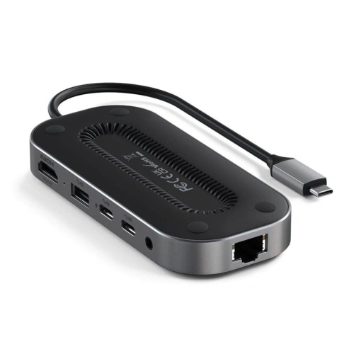 Satechi Multiport Adapter in space gray, with visible USB-C and HDMI ports.